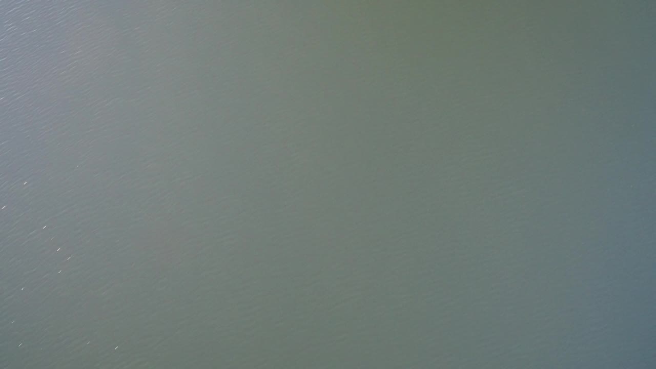 A Westminster, Colorado aerial water view with scattered light points across the surface and no visible shoreline or people.