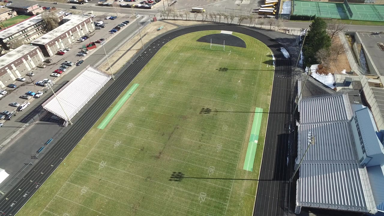 Angled aerial view of the stadium with bleachers and track.
