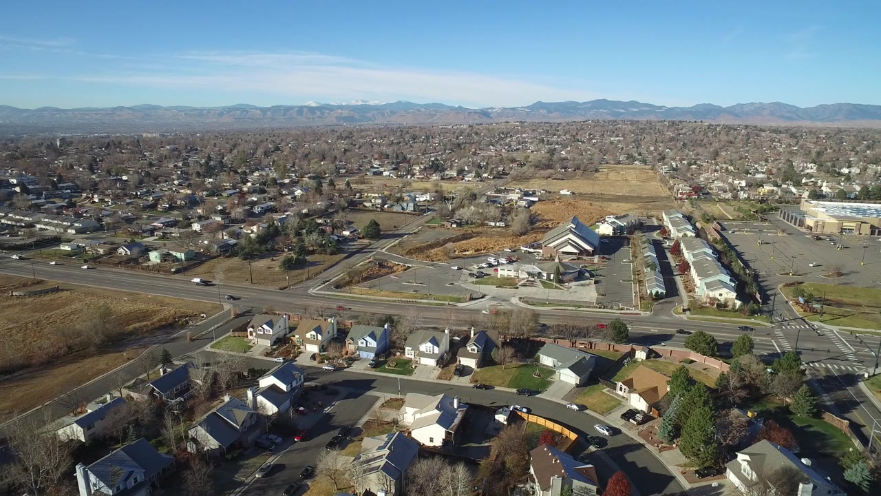 Aerial view of suburban houses beside a multi-lane road