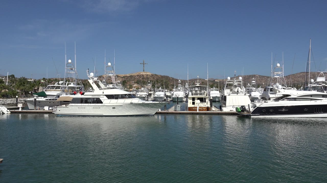 Wide marina view with yachts across calm water.