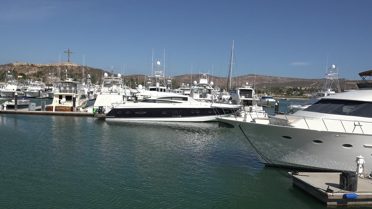 Second frame shows San Jose del Cabo marina boats from a similar dockside angle, with the foreground bow cutting in from the right and no visible people.