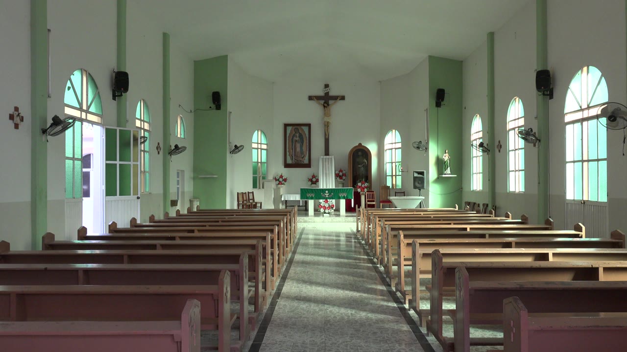 Empty church nave viewed from the back pews
