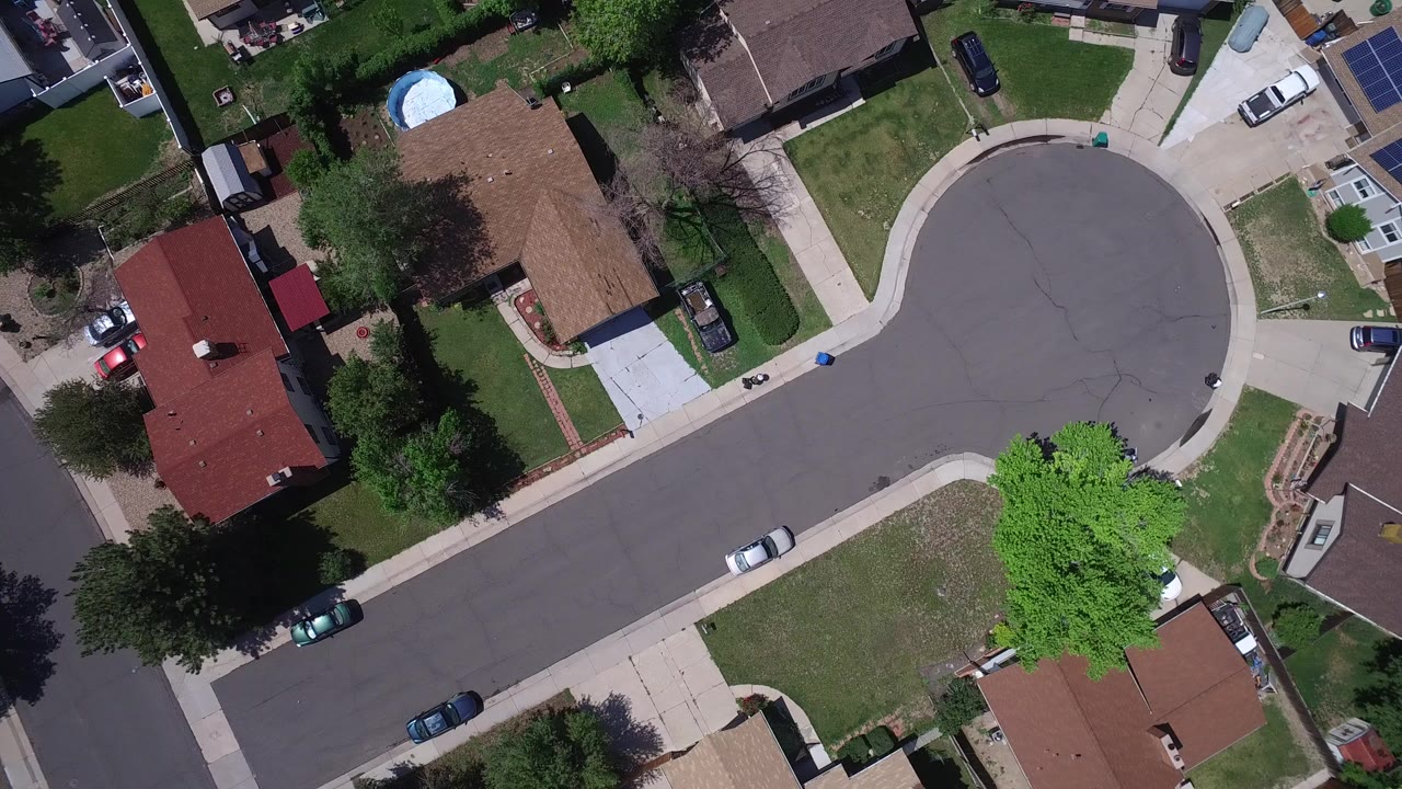 Overhead view of a suburban cul-de-sac and surrounding homes