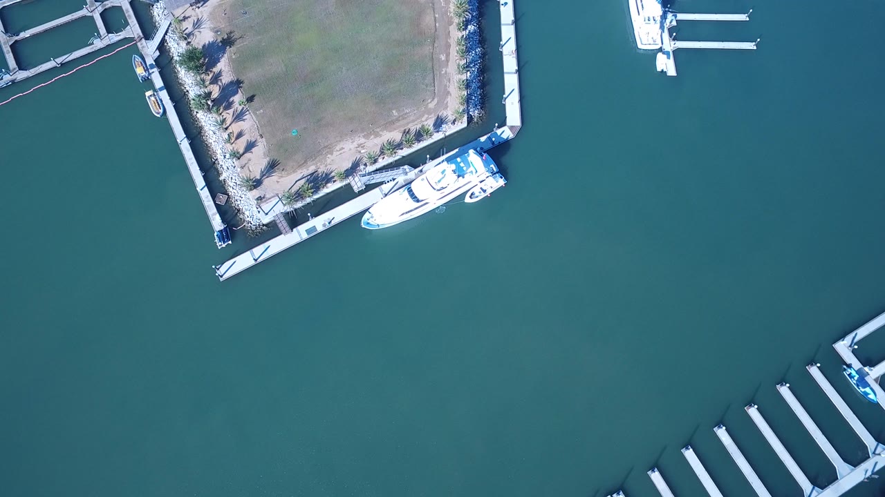 Top-down view of marina basin and empty slips.