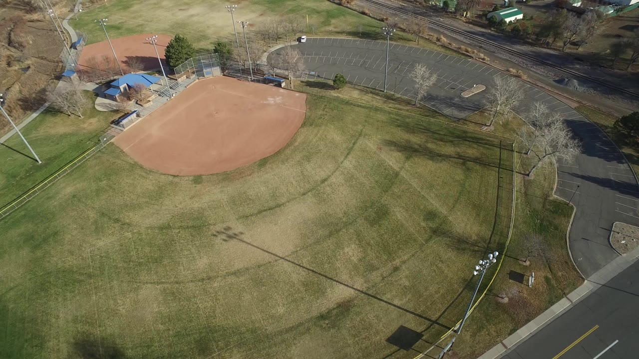 Aerial view of a baseball field and surrounding roads.