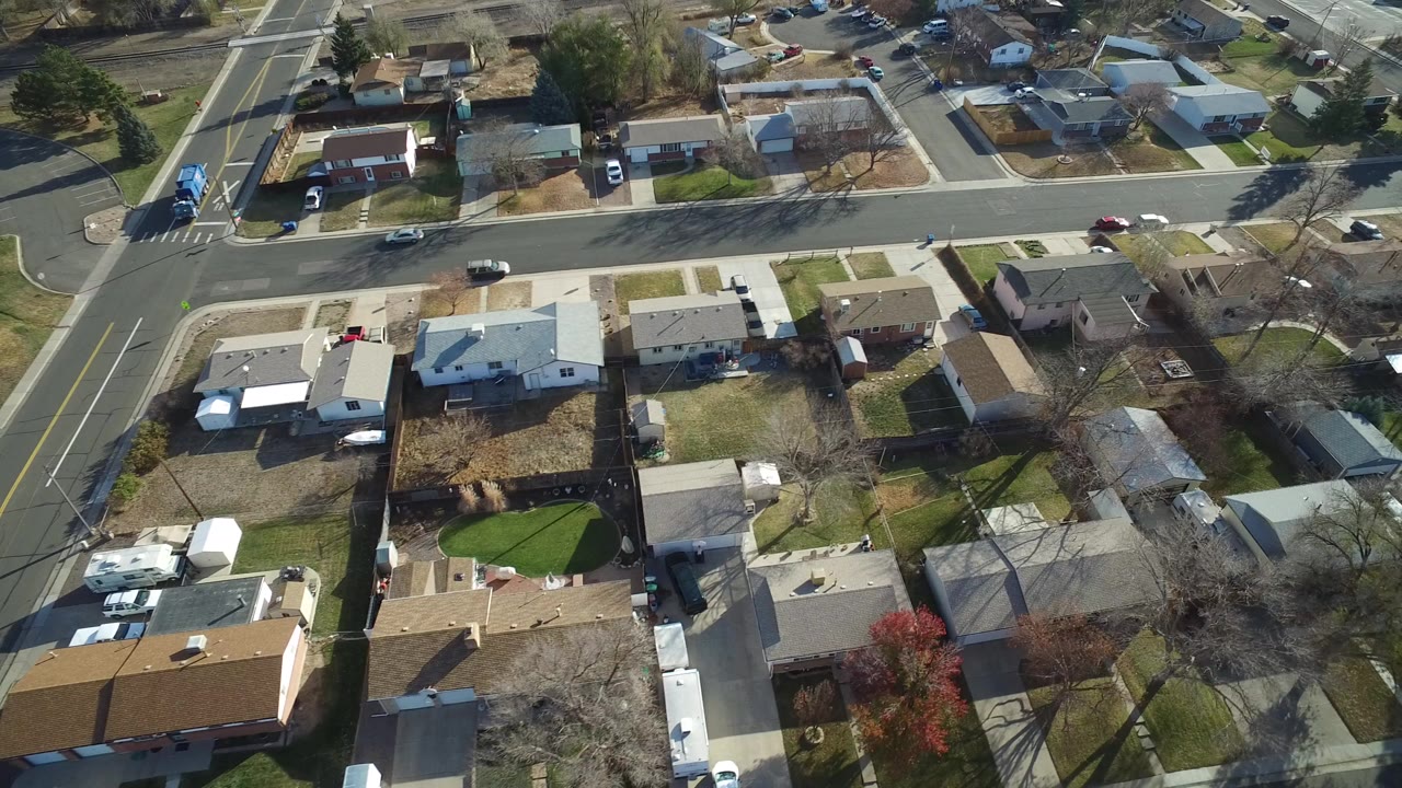 Aerial view of residential houses and intersecting roads.