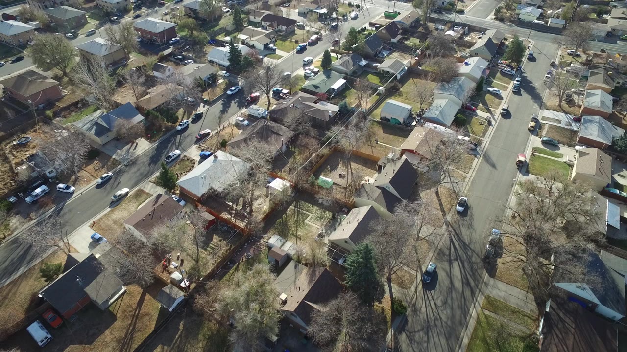 Aerial view of suburban homes and a residential street.