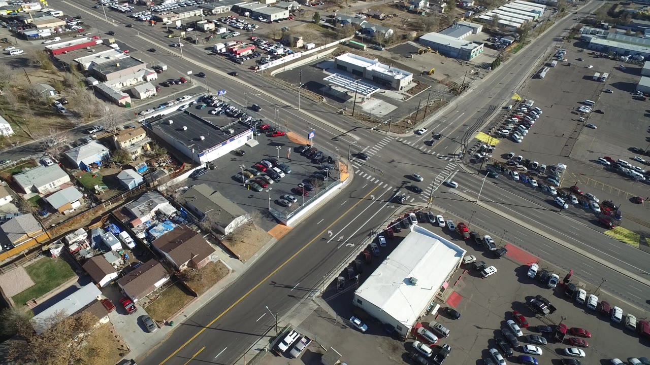 Aerial view across a suburban intersection and surrounding residential blocks.