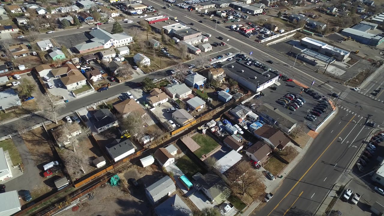 Overhead view of residential blocks near a parking lot.