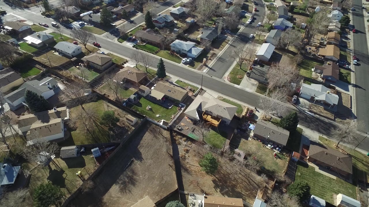 Aerial view of suburban homes and intersecting residential streets.
