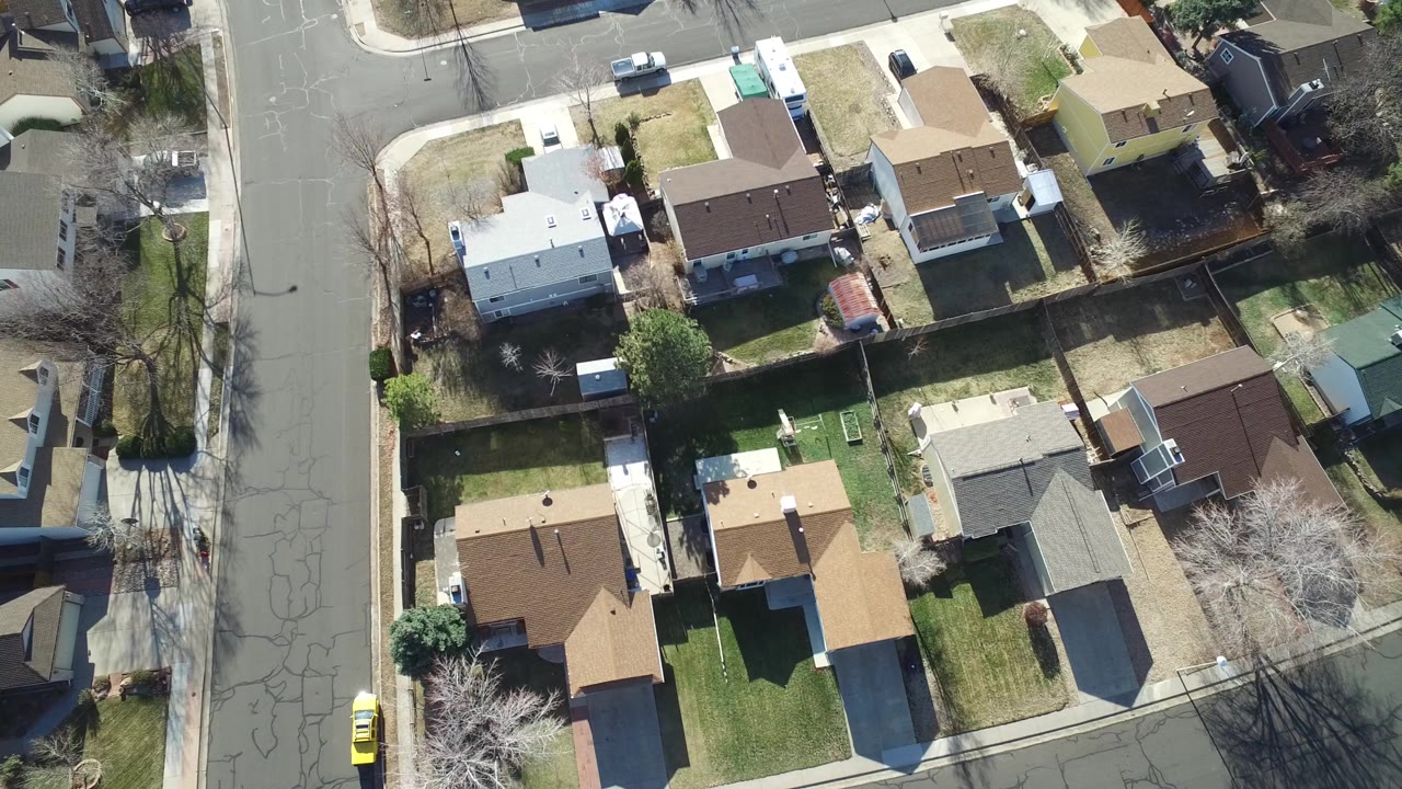 Overhead view of residential houses, yards, and roads