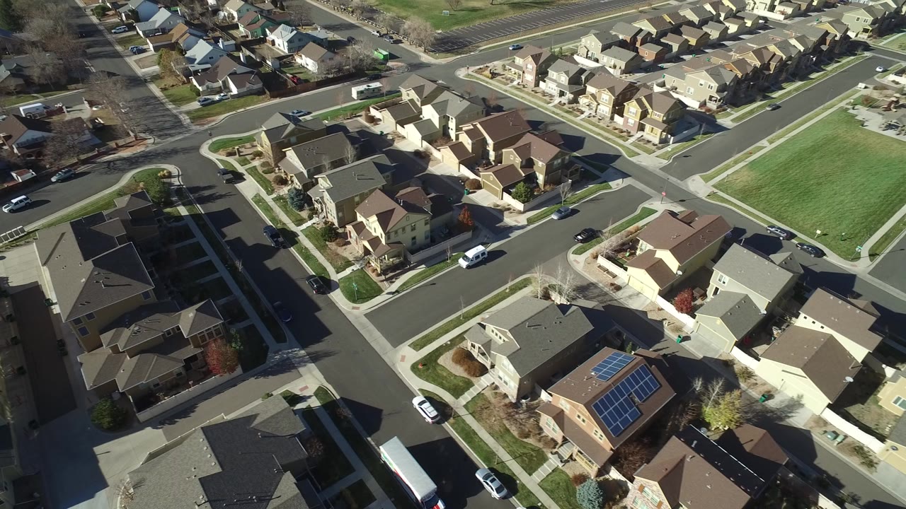 Overhead view of suburban homes and intersecting streets.