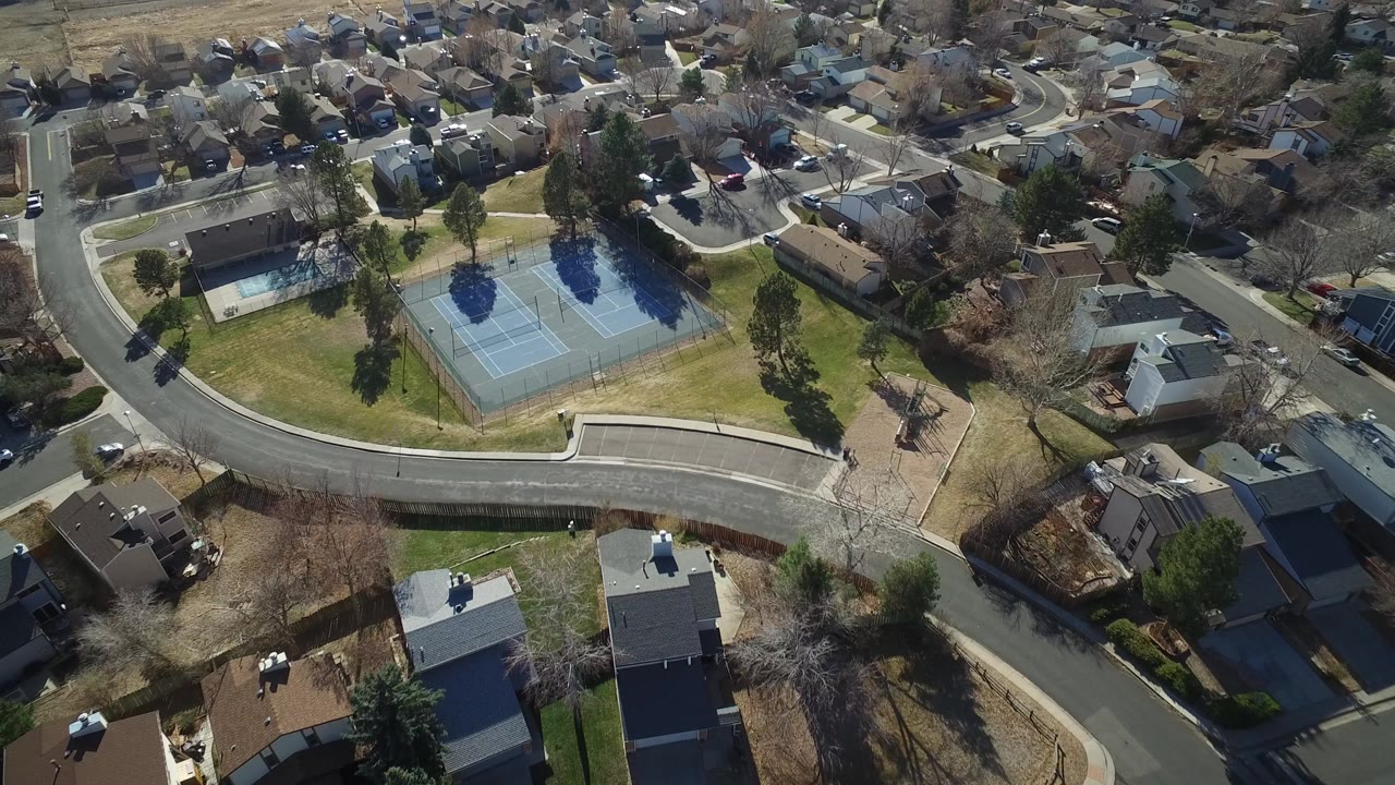 Overhead view of tennis courts and suburban streets