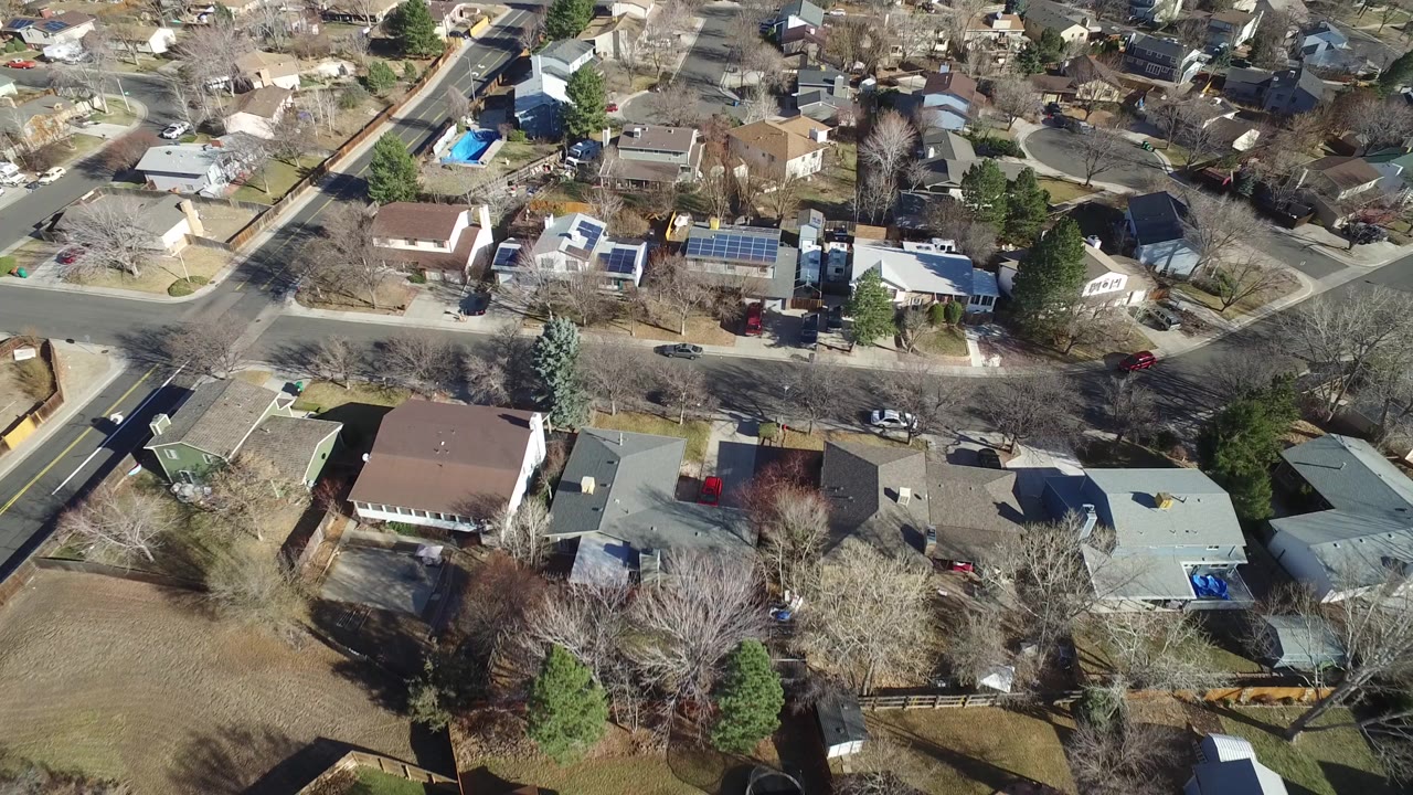 Aerial view of suburban homes and tree-lined streets.