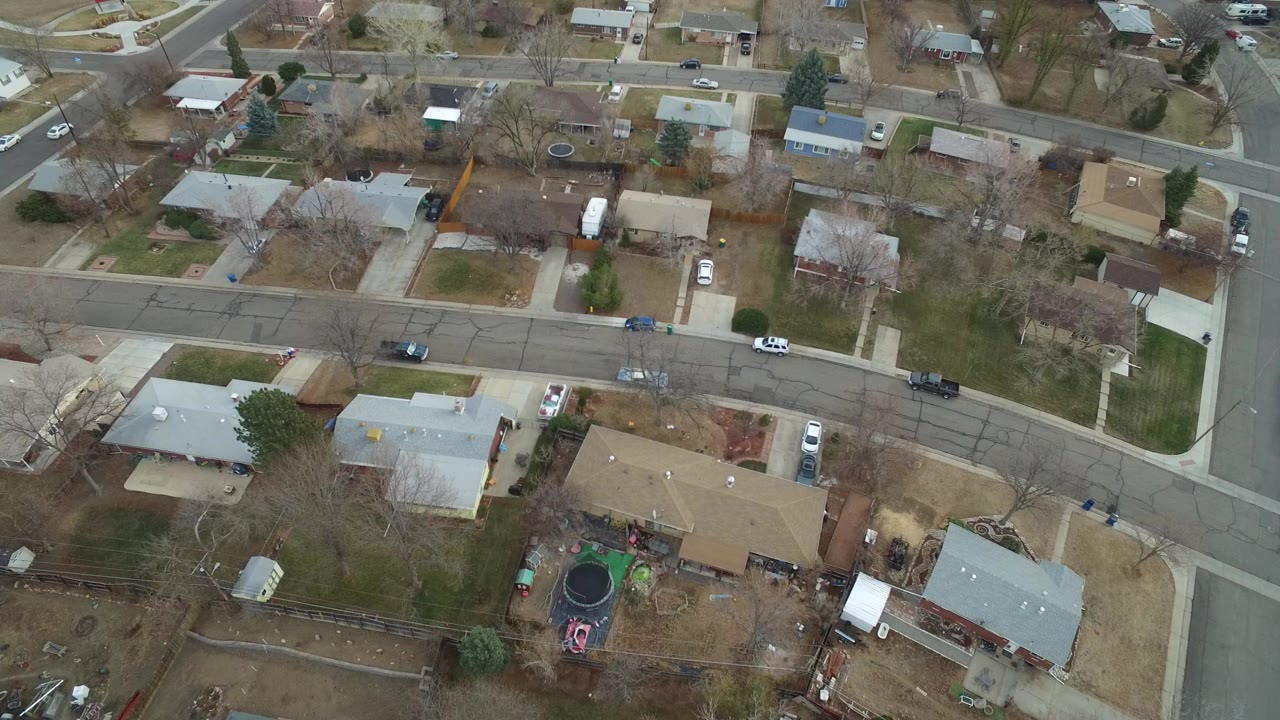Aerial view of suburban homes and intersecting streets.