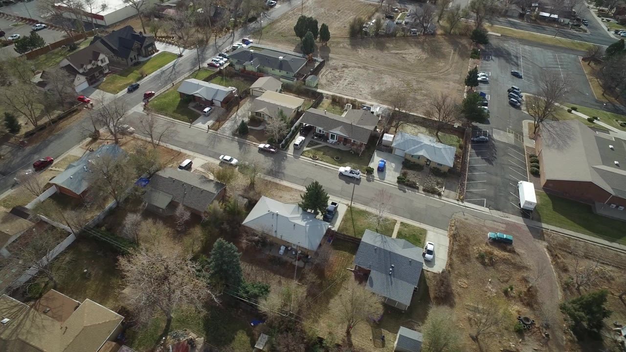Aerial view of suburban homes and intersecting roads.