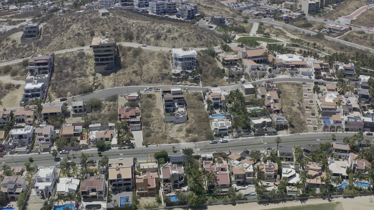 Residential blocks and hillside buildings seen from above.