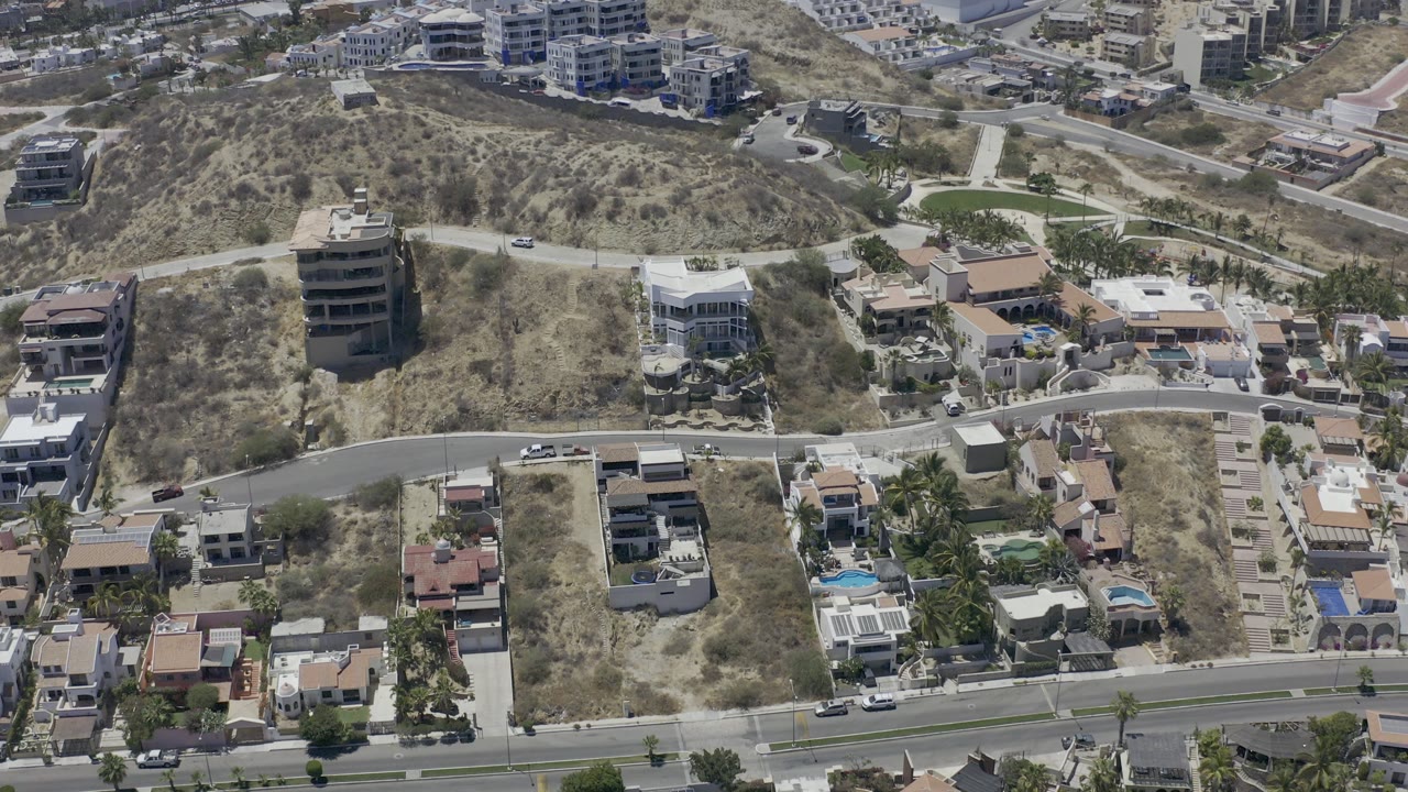 Aerial view of hillside homes and curving roads