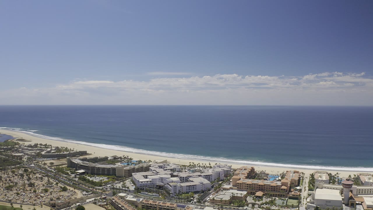 Drone-height view of beach resort area and open sea