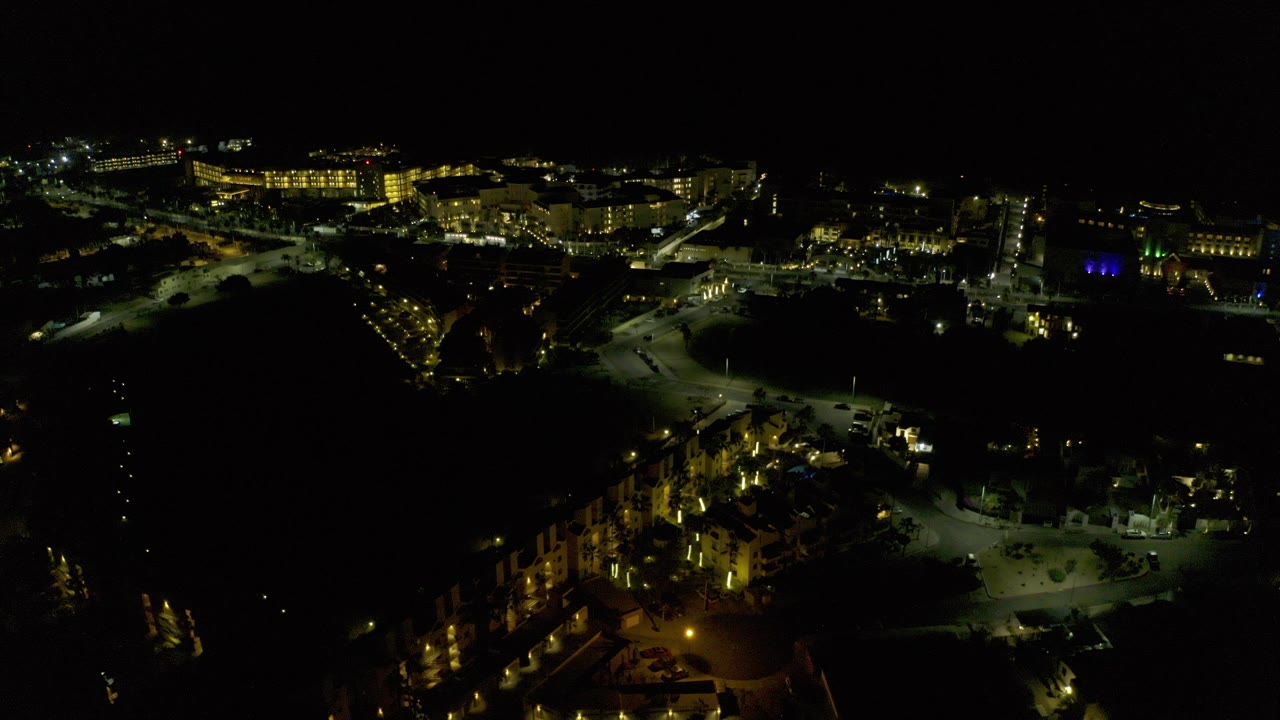 Night aerial view of lit roads and buildings