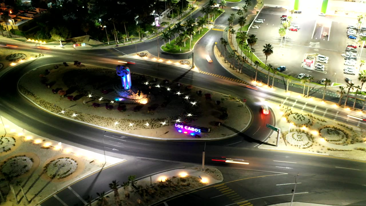 Night aerial view of a lit roundabout and roads