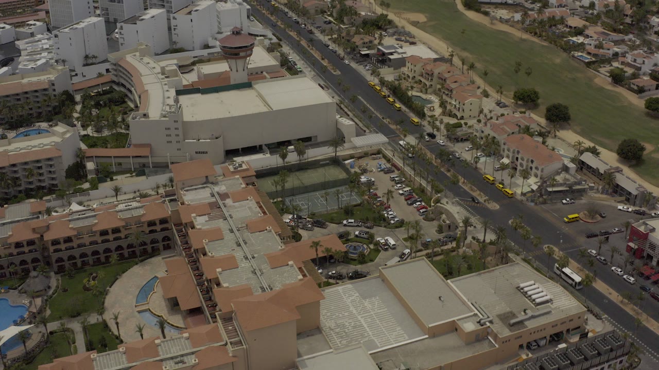 High aerial view of resort buildings and a main road