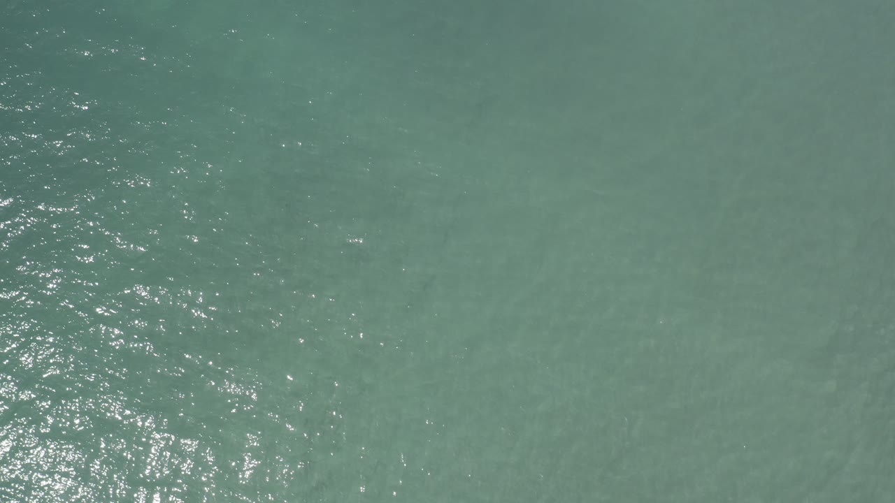 Overhead ocean water with concentrated light sparkle