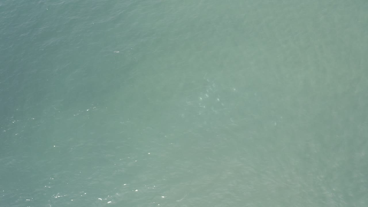 Calm water with small bright reflections
