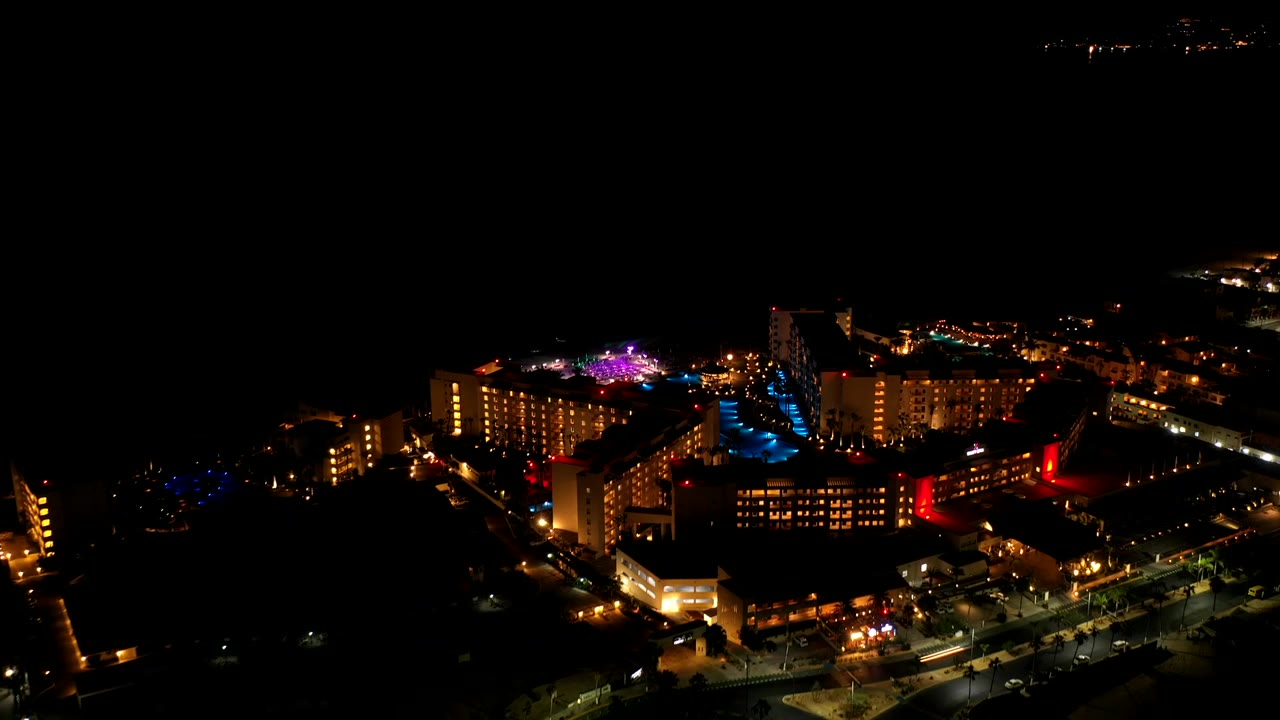 High night view of lit buildings and purple lights