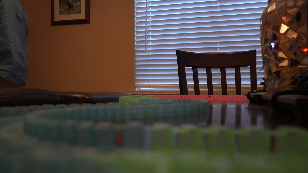 Low table view of toy train tracks in a dining room