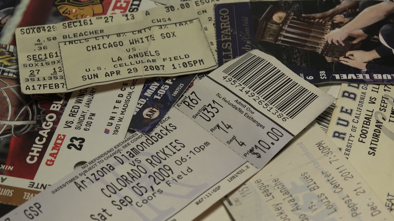 Overlapping sports tickets with barcodes and printed event details.