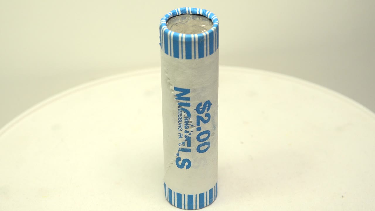 Close tabletop view of a nickel roll on a turntable