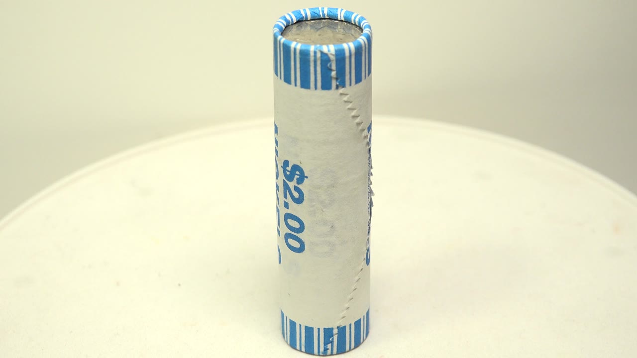 Two dollar nickel roll slightly rotated on a white surface.