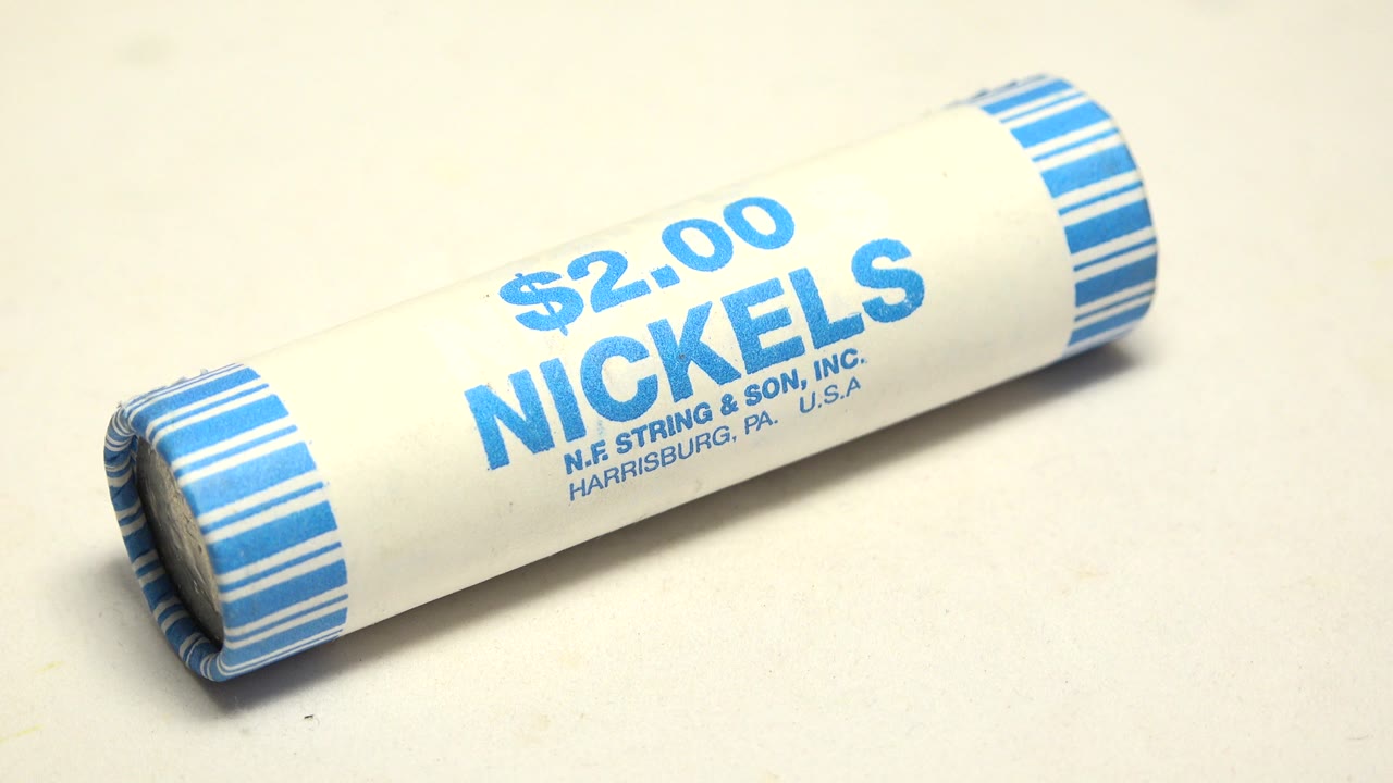 Coin wrapper end visible on a rolled nickel tube.