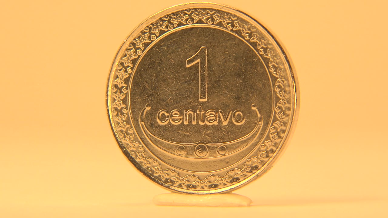 Close front view of a 1 centavo coin with visible border detail.