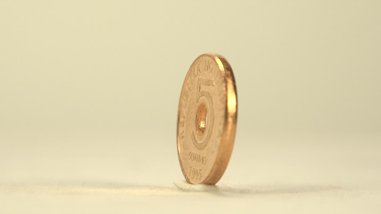 Coin shown from a narrow edge angle.