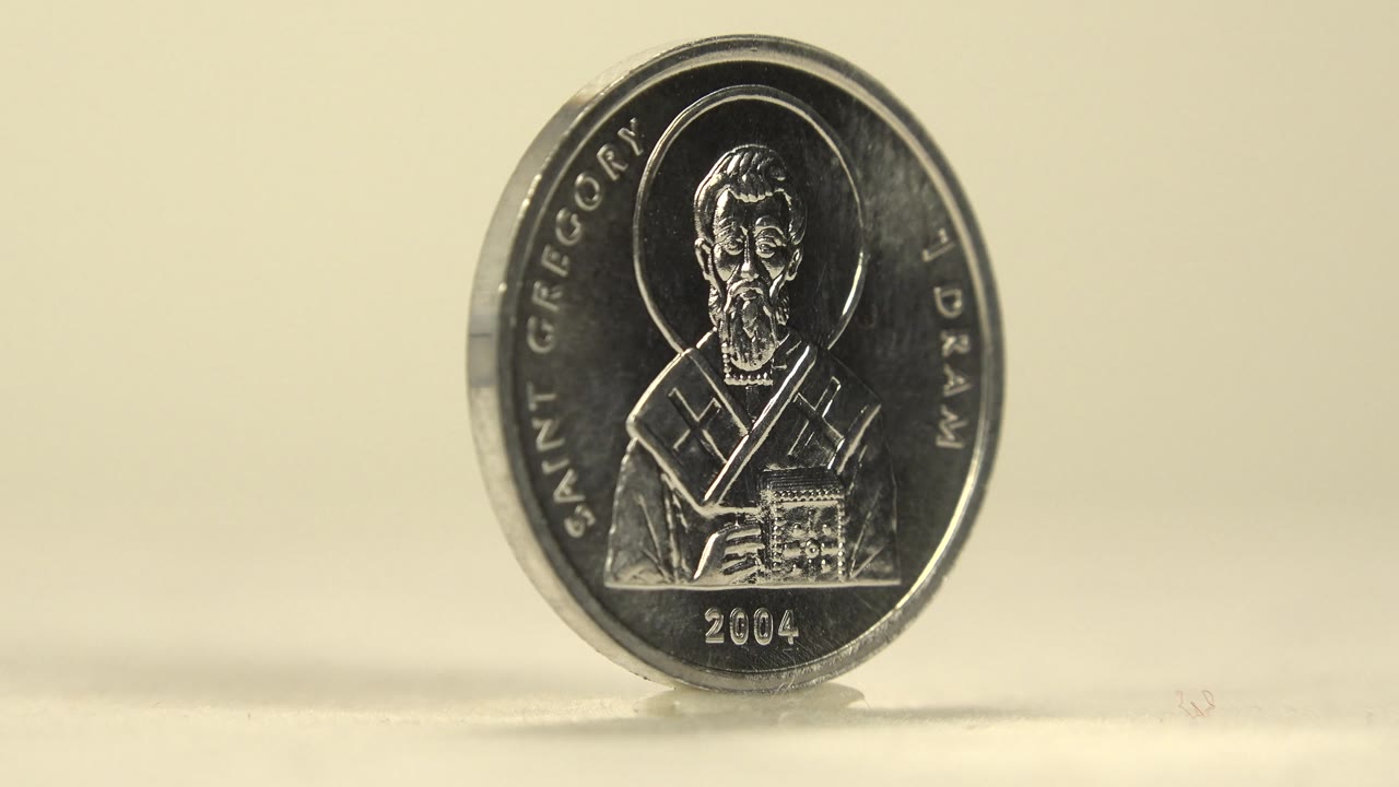 Front of a silver coin with Saint Gregory text and 1 Dram marking.