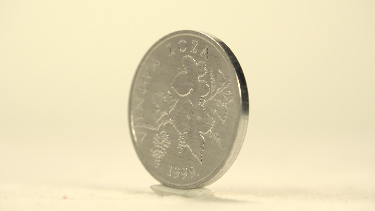 Silver coin turned partly sideways
