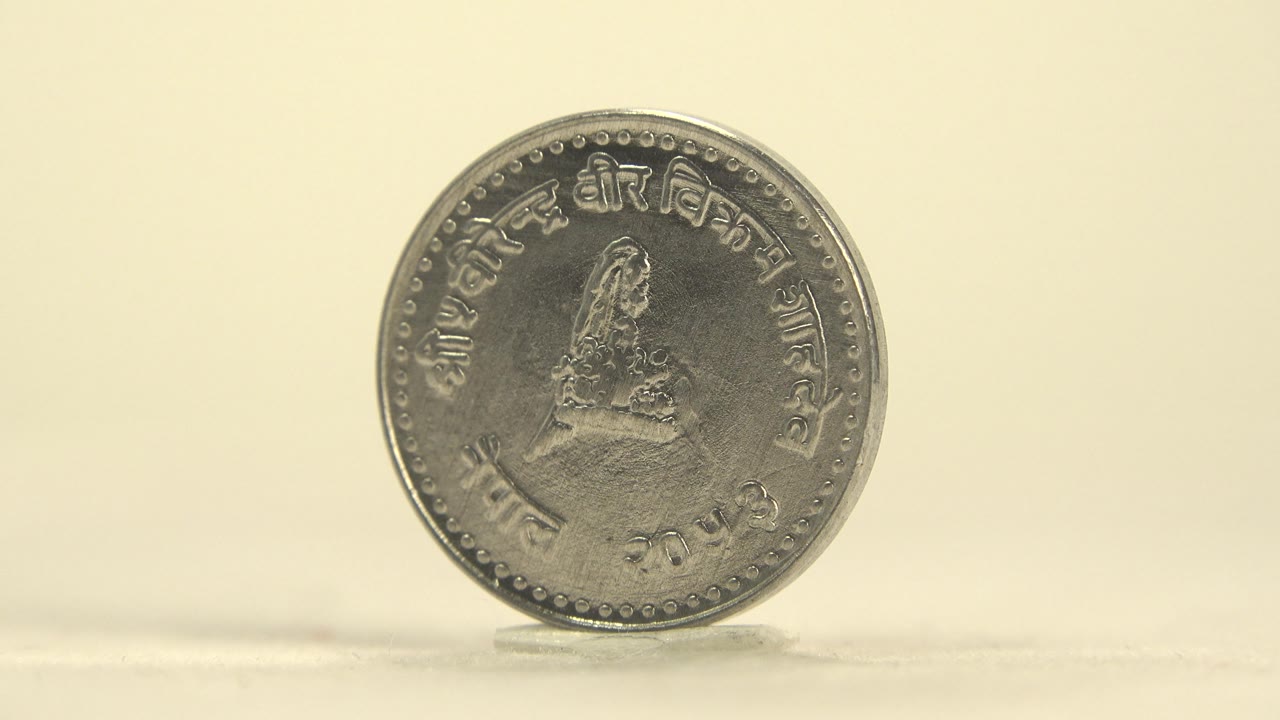 Darkened face of upright silver coin