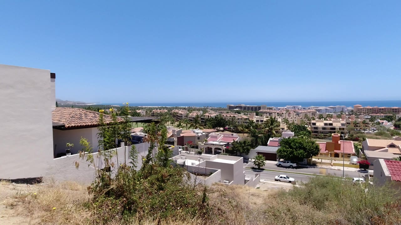 Hillside property view over homes toward the sea