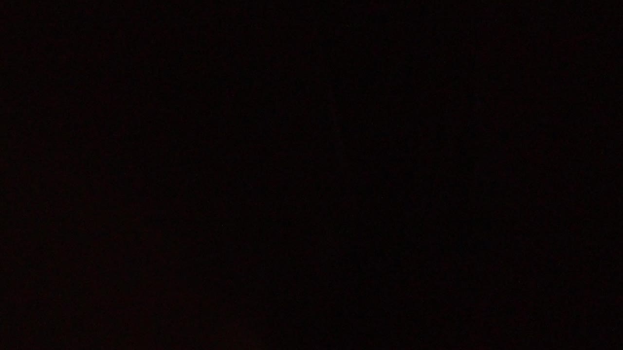 Nearly black frame with faint reddish texture