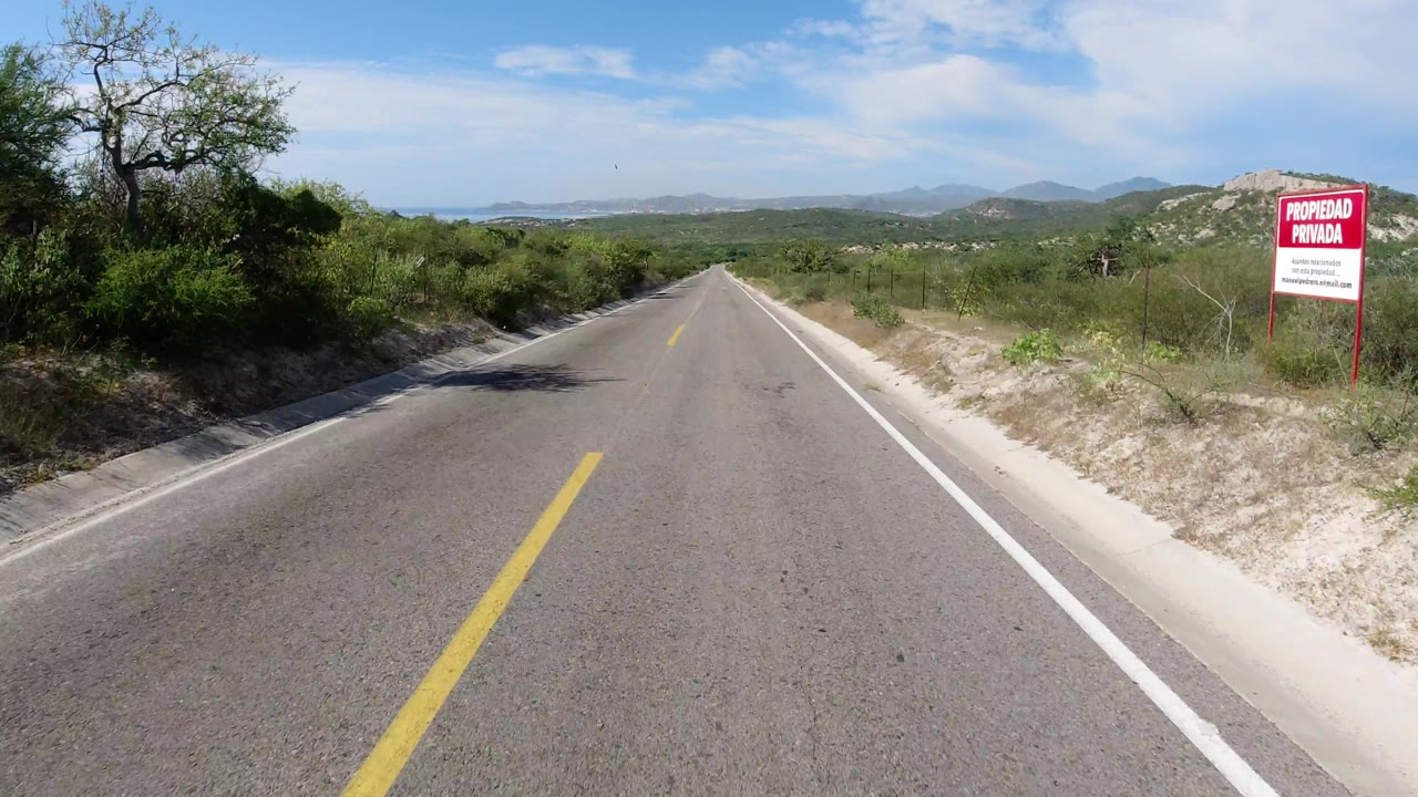 Roadside view with a private property sign on the right.