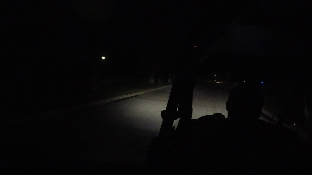 Dark road seen through a vehicle at night