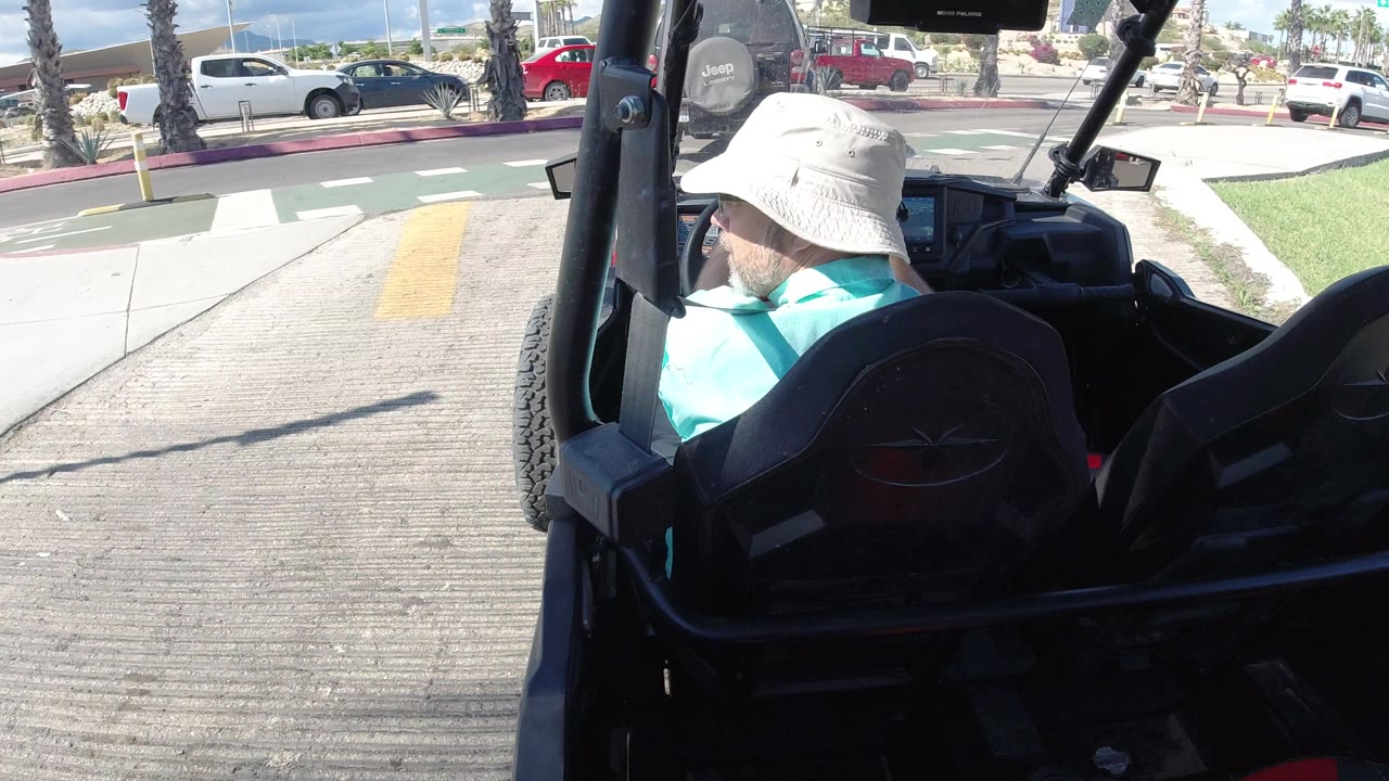 Four-wheeler beside a painted road crossing