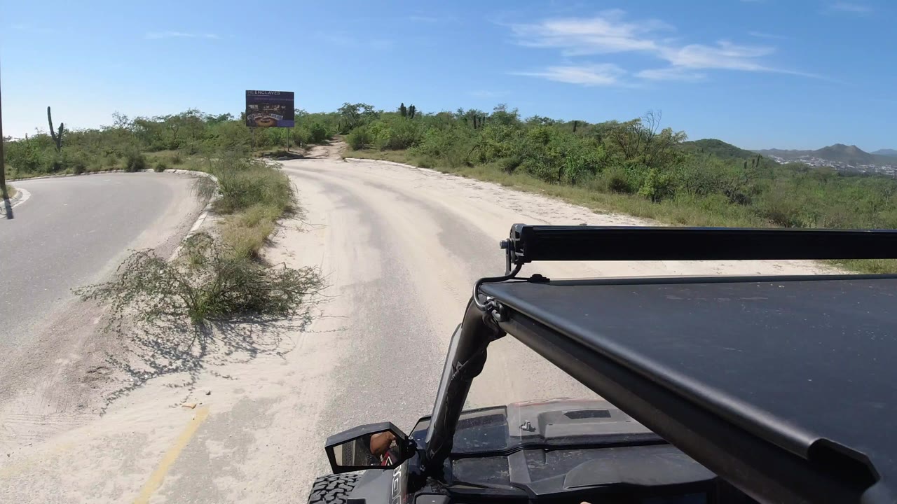 Off-road vehicle view approaching a fork in a desert road