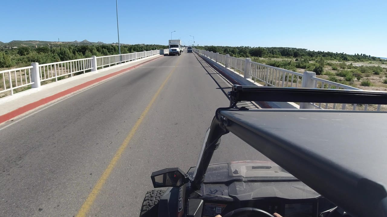 Oncoming truck appears on the bridge road.
