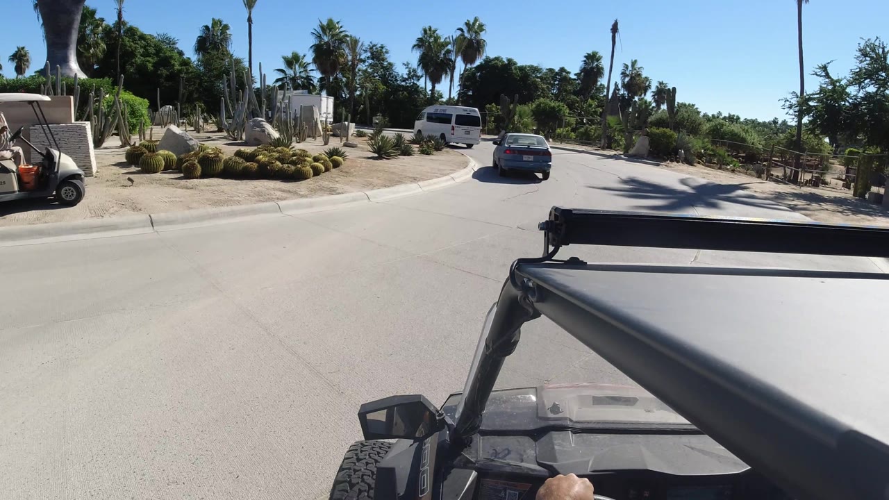 Vehicle POV approaching a curve with cars ahead