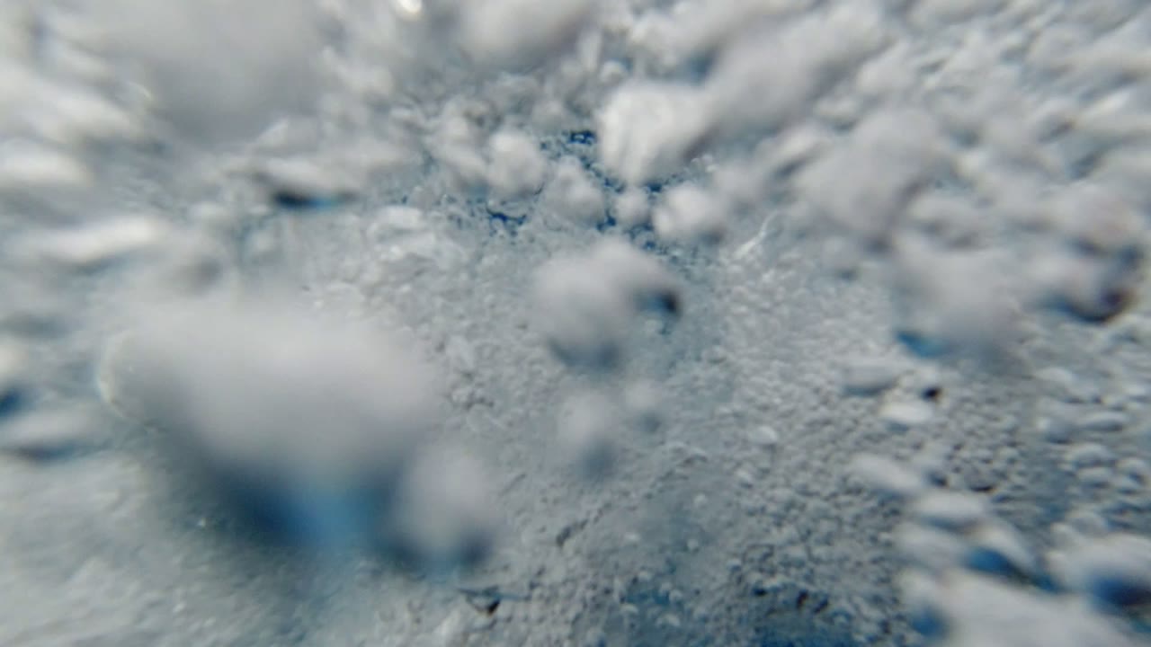 Close underwater bubbles and foamy water texture