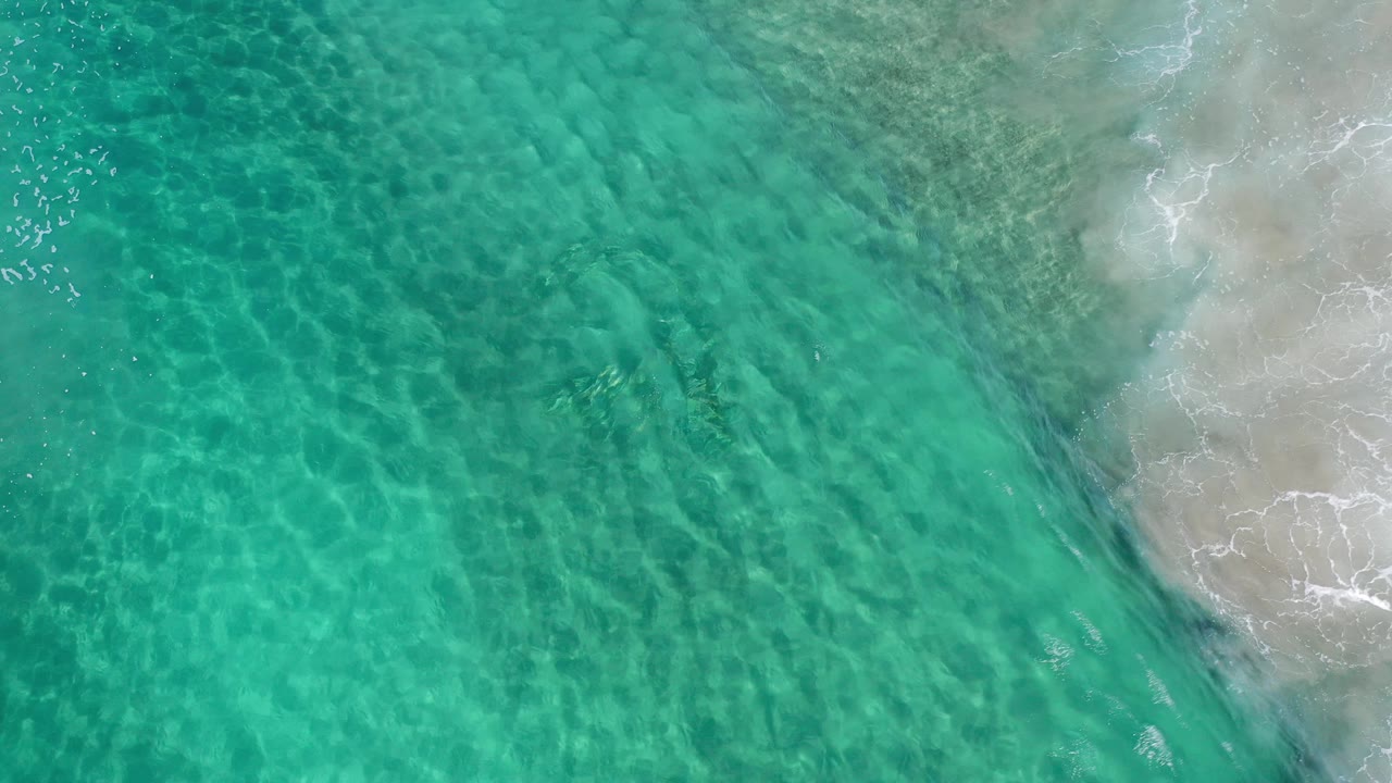 Aerial shallows with rippled water and sandy edge