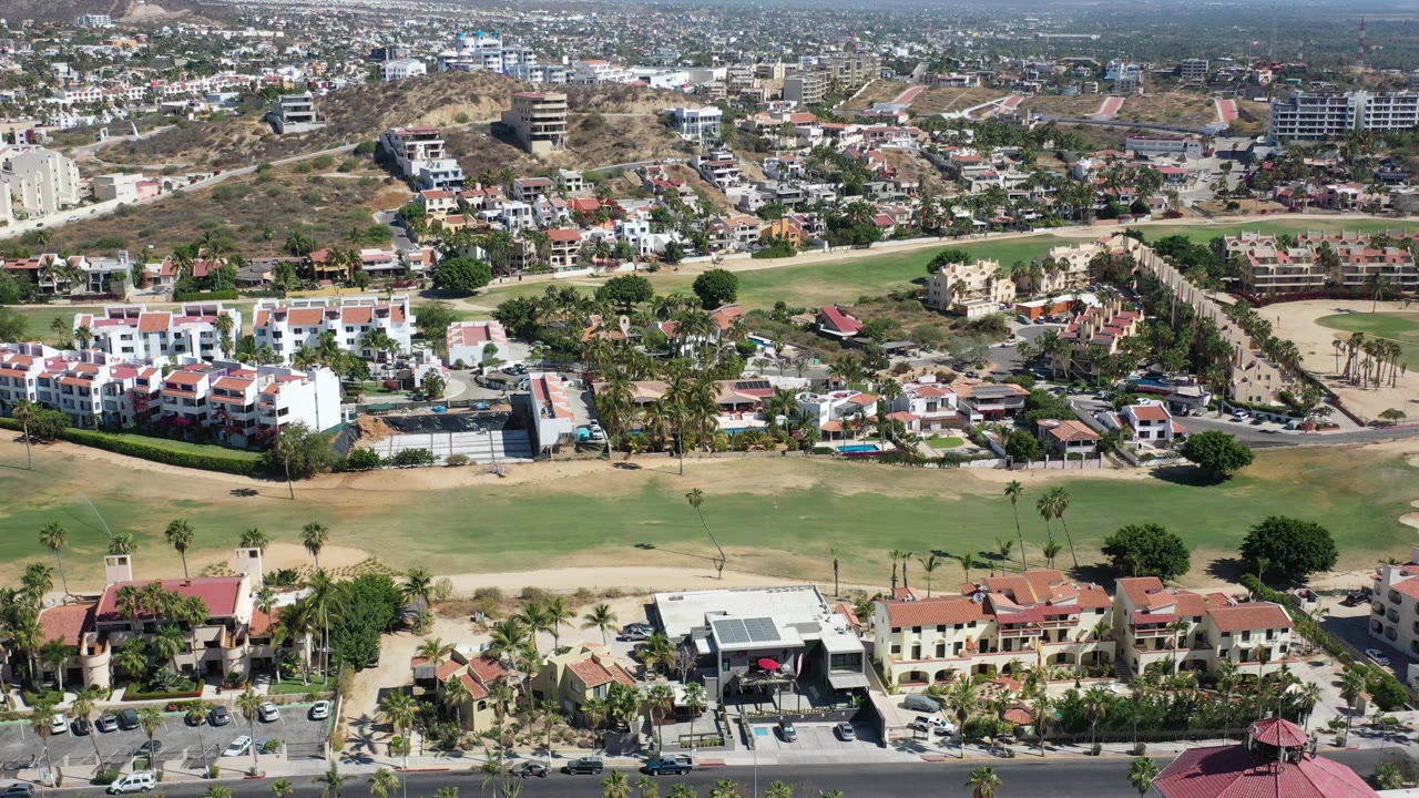 Aerial view of golf fairways and homes in Los Cabos.